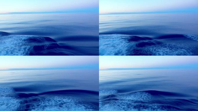 蓝色波浪形背景。海平面平稳移动并形成涟漪。