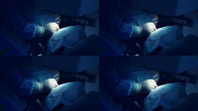 眼科医生进入麻醉。病人在手术期间正在接受眼睛麻醉。激光校正。特写。蓝光。