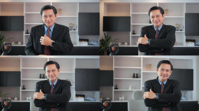 他是一位专业而聪明的亚洲顶级经理，双臂交叉，看着办公室的相机。