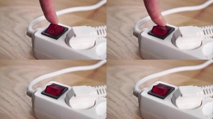 打开红色按钮开关，用于从连接器供电。带连接插头的白色电源板