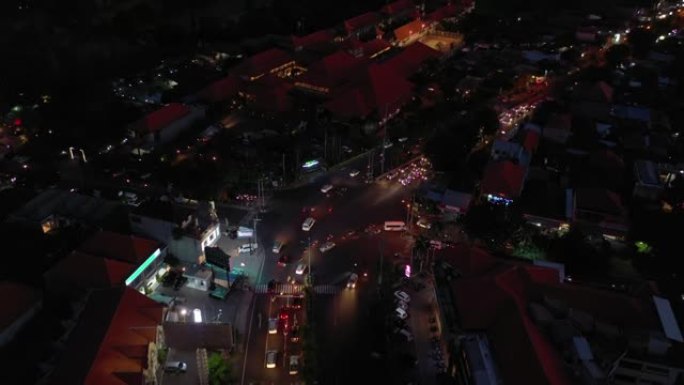 日落黄昏巴厘岛小镇交通街十字路口空中海岸线全景4k印度尼西亚