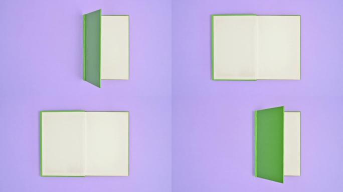 浅绿色精装复古书以紫色为主题并打开。停止运动平铺