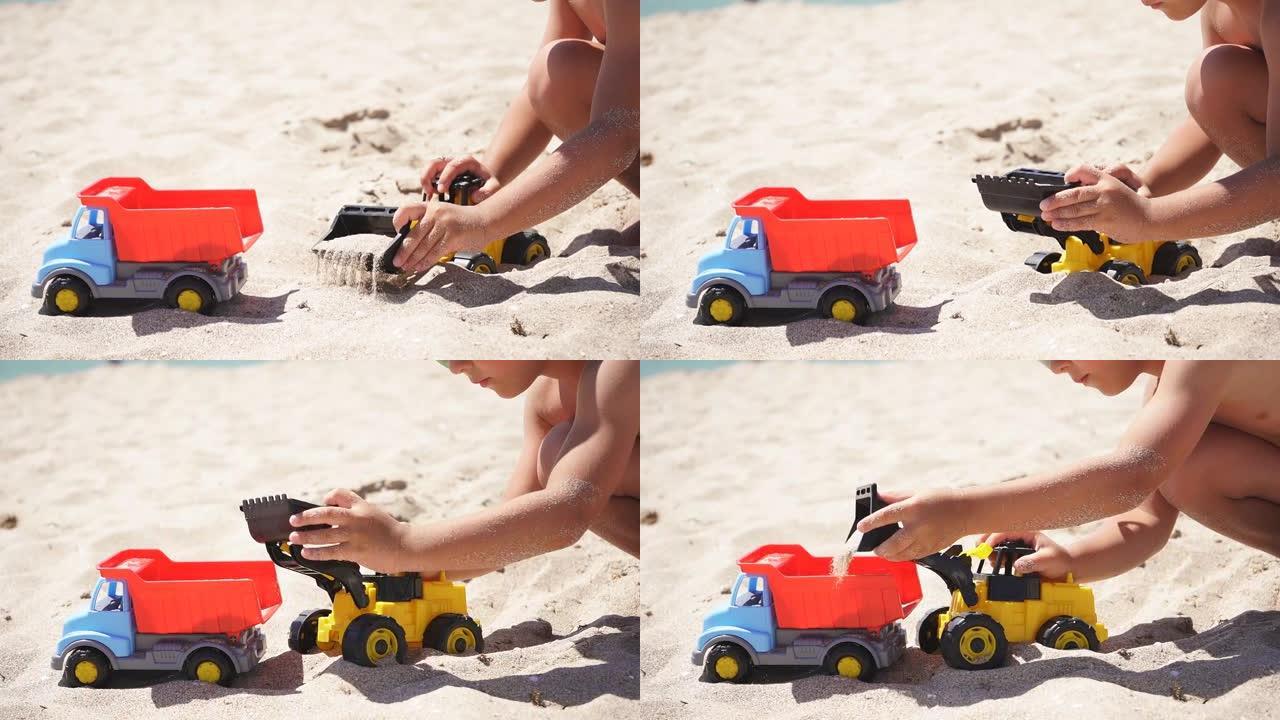 一个晒黑的男孩在沙滩上玩耍的特写镜头，一辆塑料玩具车，一辆铲子的挖掘机