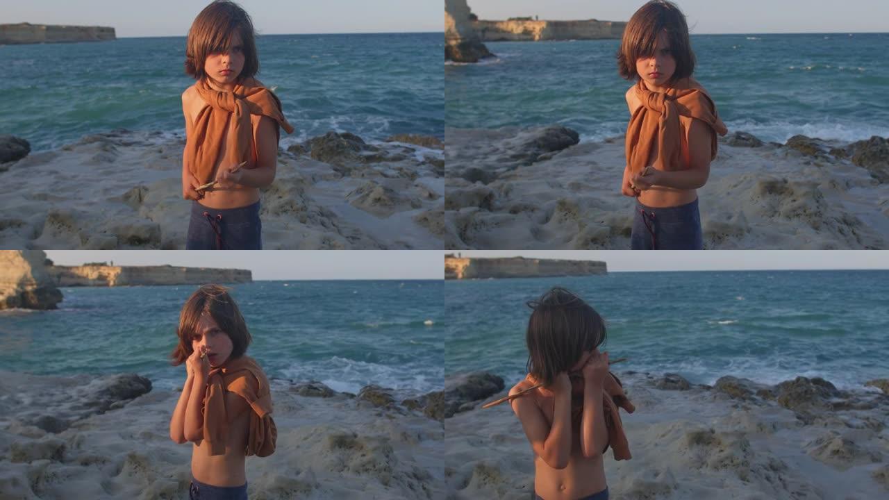 一个孩子在海上的肖像。他手里拿着长矛。生存游戏。