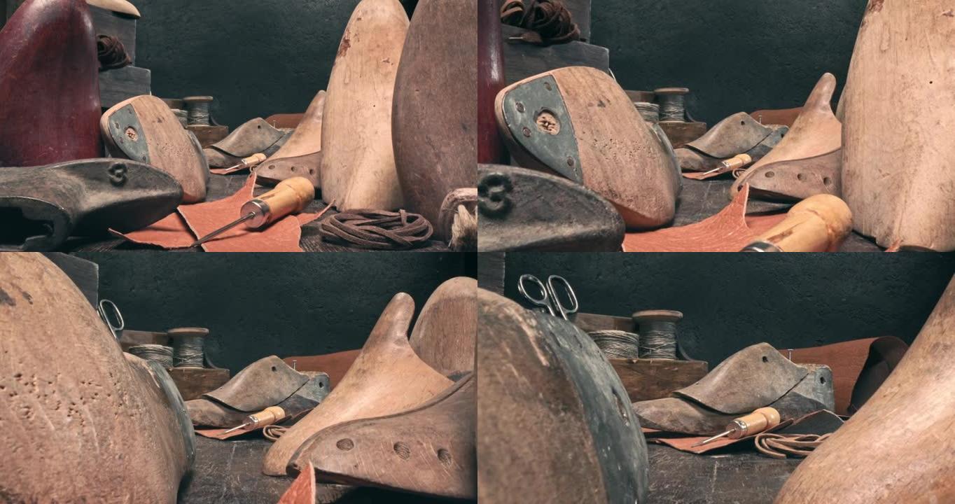 带工具、皮革和表带的补鞋匠车间。老式鞋匠车间。