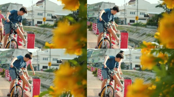 亚洲儿童骑自行车一起看风景，生活方式理念。