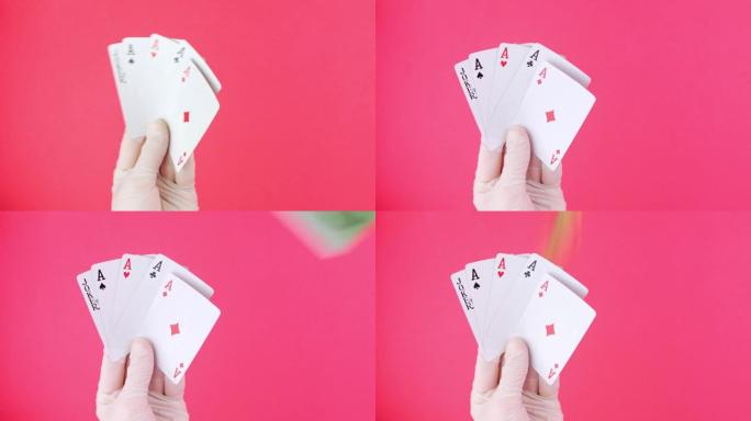 赌徒手中的五种扑克游戏卡掉落钞票粉红色背景。幸运组合ace和Joker揭示。在线赌博赌场游戏赢家成功