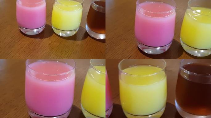 健康的各种新鲜果汁饮料在玻璃杯中包含苹果汁，番石榴汁和菠萝汁。