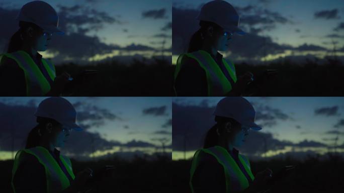 夜间风力涡轮机评估女工程师的视频
