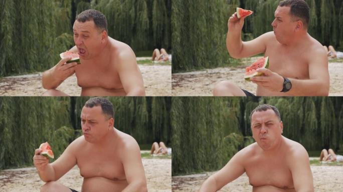 一个男人在野餐时吃多汁的西瓜。炎热的夏天，美味的水果