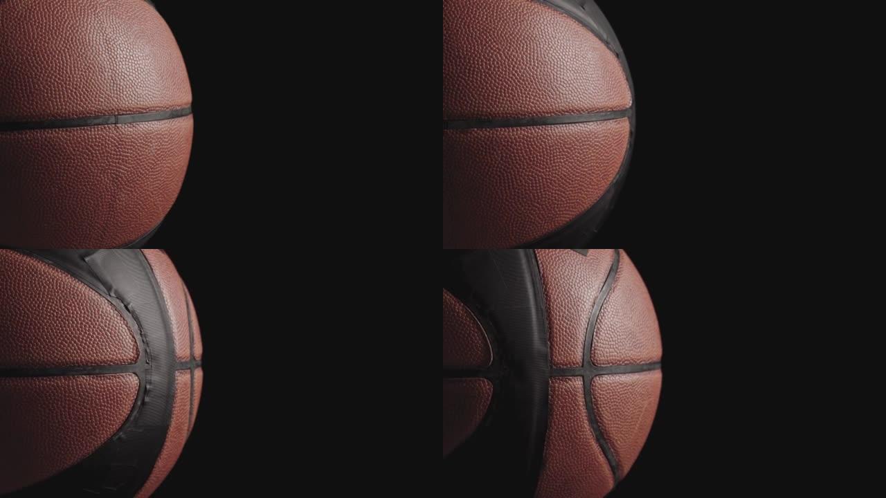 摘要特写篮球旋转。在黑暗背景下现场点燃篮子球。运动设备