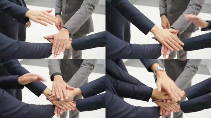 商人握手叠手特写，为企业合并伙伴关系和商业交易的团队合作，成功谈判，握手，