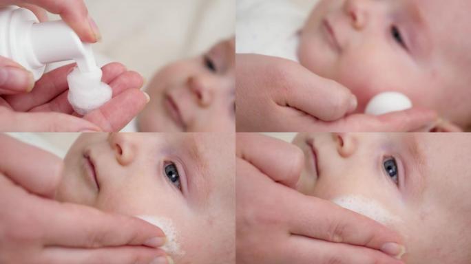 在患有皮炎和痤疮的红色婴儿脸颊上使用药物乳液的特写镜头。新生婴儿卫生、健康和皮肤护理的概念