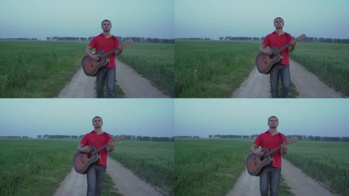 穿着牛仔裤的男人走在田野的道路上，弹原声吉他