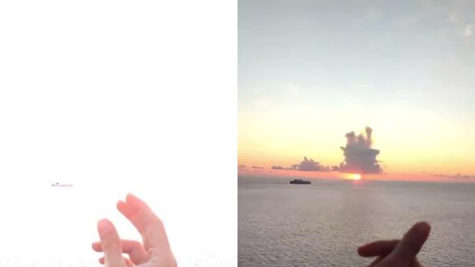 时髦的视频手指点击过度曝光的天空显示日落