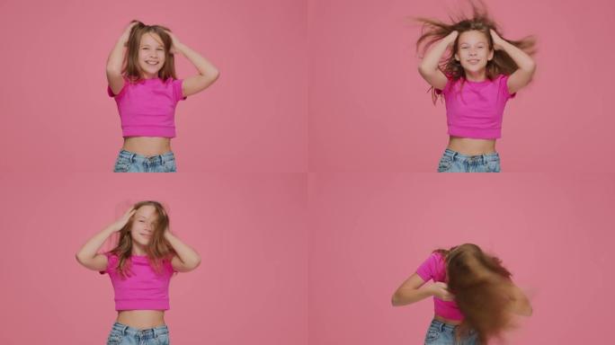 有趣的精力充沛的小女孩孩子皱着长长的金发，摇头，玩得很开心。儿童护发化妆品广告