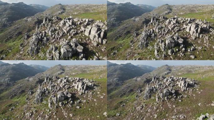 无人机在葡萄牙北部著名的peneda geres国家公园的岩石束缚层上方飞行