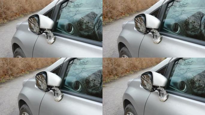 爱沙尼亚灰色汽车的一面破碎的后视镜