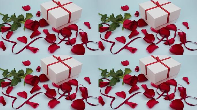 情人节快乐。现。红玫瑰花瓣和红丝带