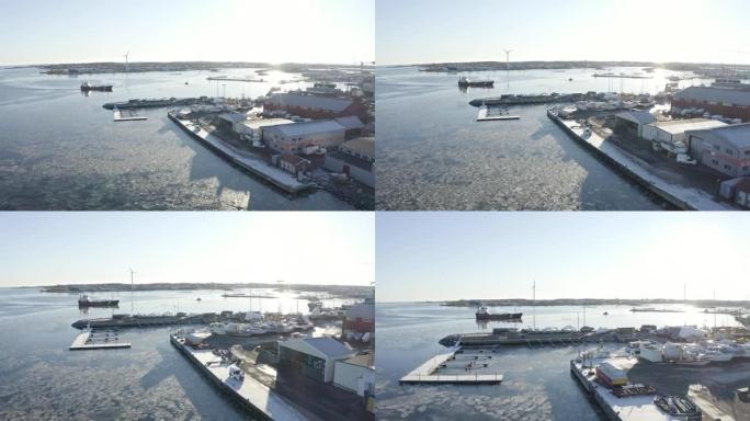 无人驾驶飞机拍摄了一艘大船驶向瑞典哥德堡群岛 ö ckerö Island市港口的港口。