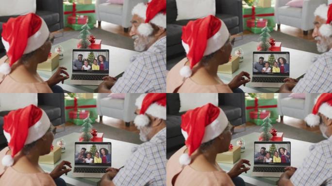 快乐的非洲裔美国高级夫妇在圣诞节与家人进行视频通话