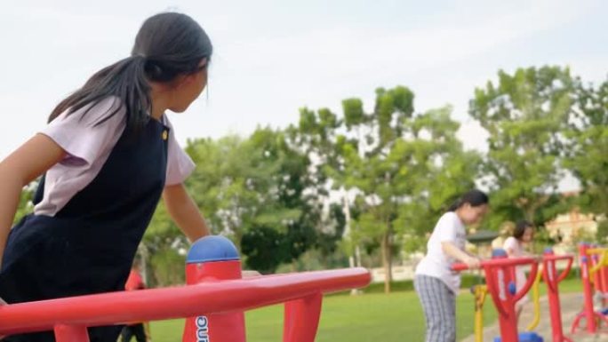 亚洲儿童与运动器材一起户外锻炼，生活方式理念。
