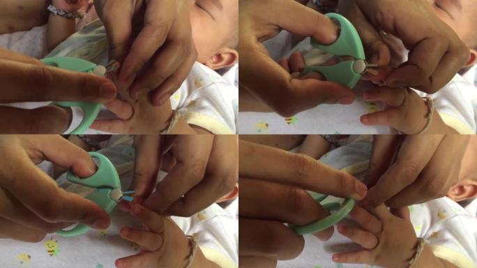 母亲为亚洲女婴剪指甲，在家中客厅的床垫上放松
