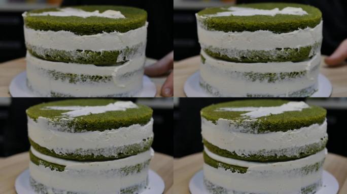 准备多层绿色海绵菠菜蛋糕。涂抹奶油