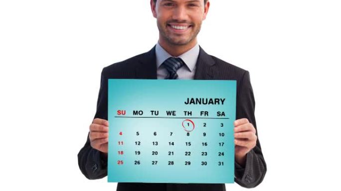 微笑的高加索商人拿着1月日历，红色戒指在1月1日上