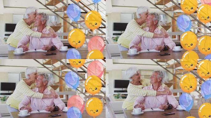 快乐的高加索高级夫妇在家里的餐厅拥抱派对气球的动画