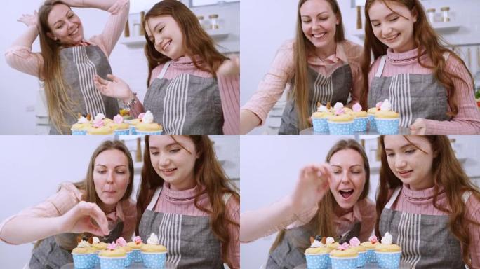 母女俩在家里的厨房里帮忙做杯子蛋糕