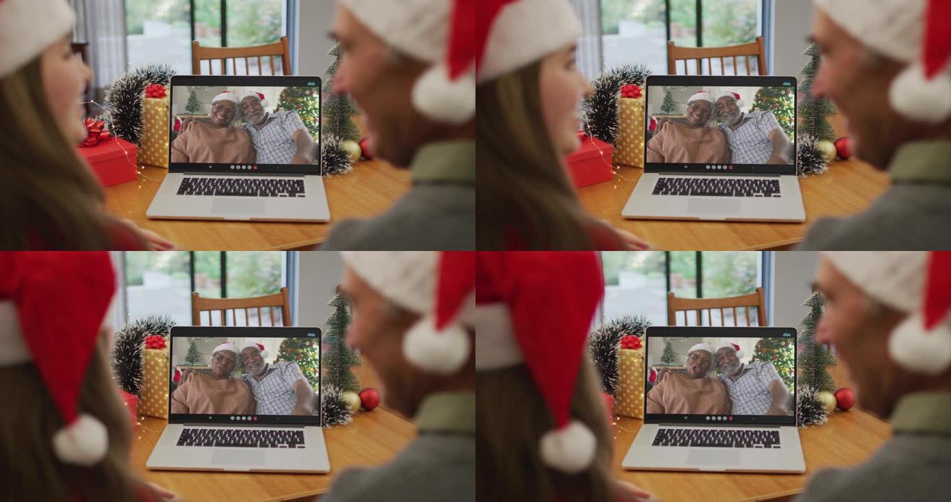 圣诞节期间，白人成年女儿和高级父亲与高级朋友进行视频通话