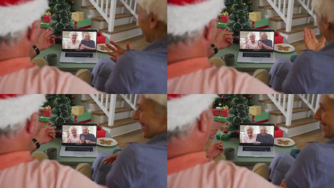 快乐的高加索高级夫妇在圣诞节与高级朋友进行视频通话