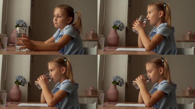 口渴的小女孩在练习本上写作的特写侧视图，休息一下，喝着新鲜的清凉过滤的清澈水，防止脱水。