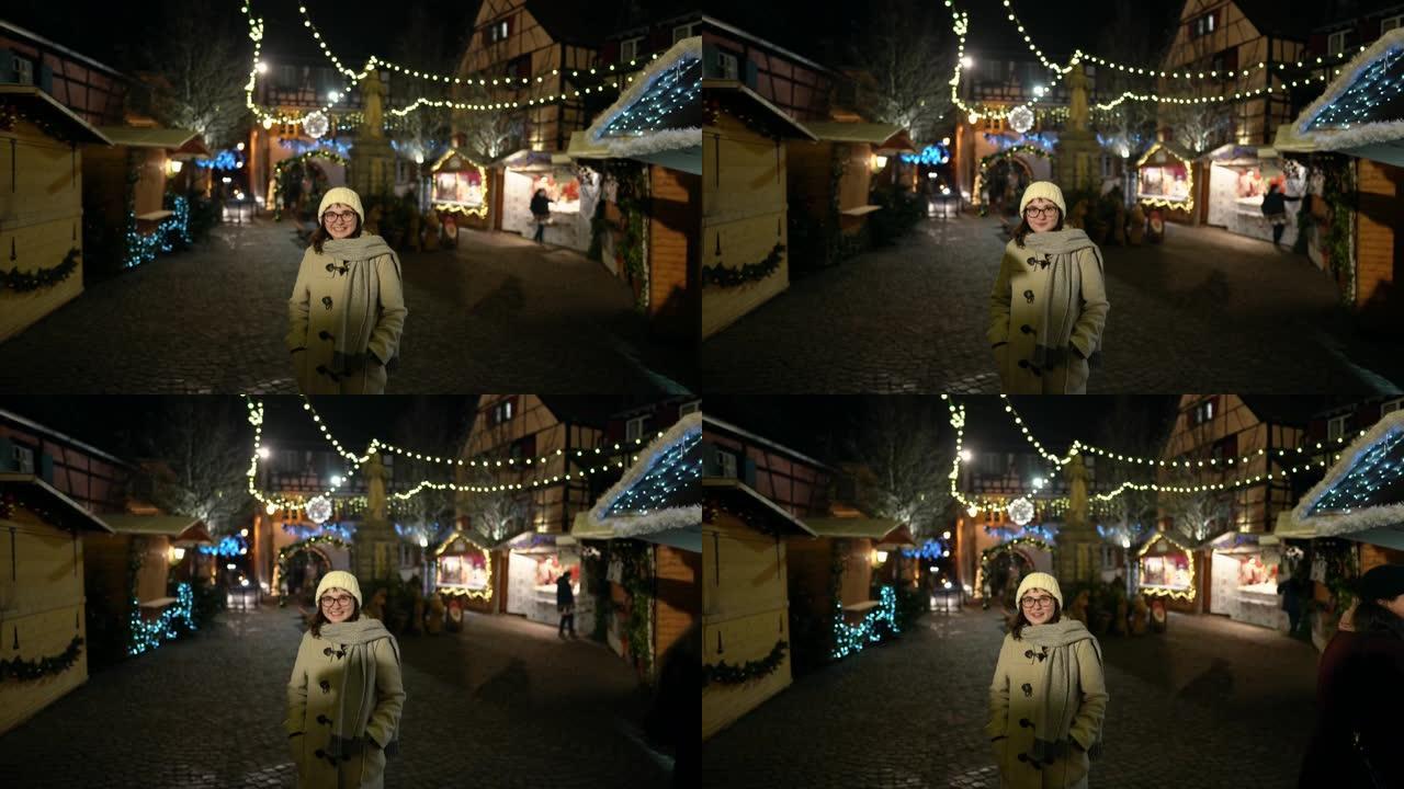 女人在圣诞节在科尔马 (Colmar) 附近行走
