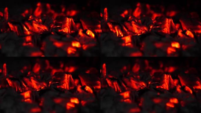 闷烧的余烬。烧烤架中红色木炭的燃烧质地。