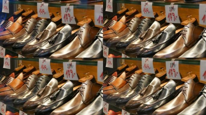 鞋店橱窗货架上有不同颜色的不同经典真皮男鞋，价格标签有折扣销售