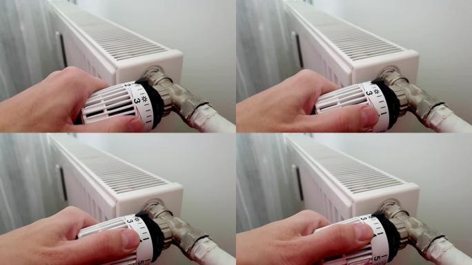 手移动温度水平。电池温度控制器。恒温器特写。中间位置