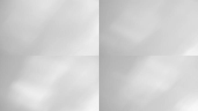 灰色和白色光滑的bokeh抽象背景，模糊的自然阴影运动