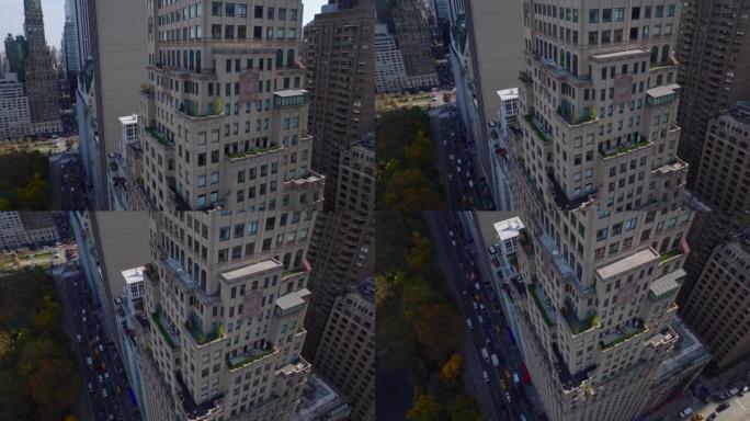 高层豪华酒店建筑的上升航拍画面。向下倾斜到周围的街道。美国纽约市曼哈顿