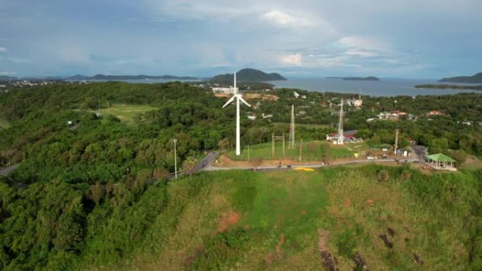 无人机通过风力涡轮机飞行，风景优美，泰国普吉岛