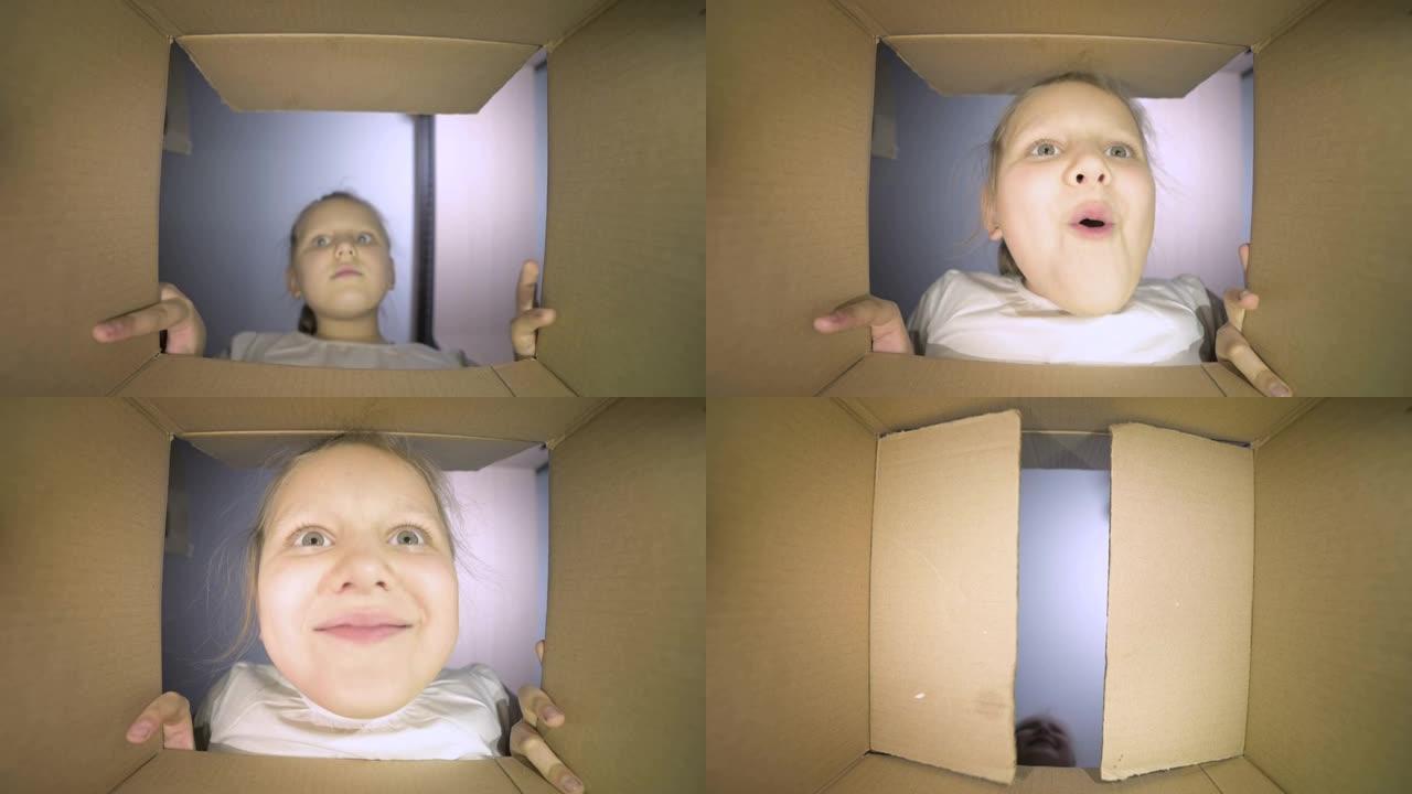 一个小女孩打开一个纸箱，高兴地喊道。盒子的内部视图。女孩说哇