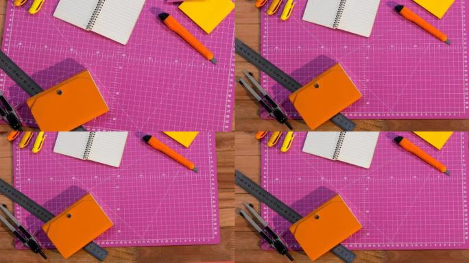 粉红色工艺垫上的记事本和工艺工具的动画