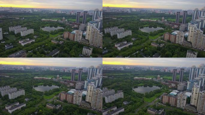 俄罗斯日落天空莫斯科现代生活街区湖城市景观空中全景4k