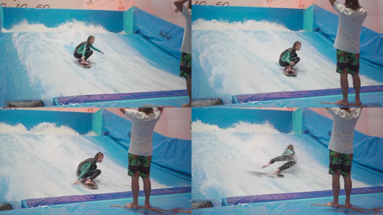 水上运动活动，平衡概念。享受室内冲浪的小运动员。青少年在体育馆的模拟器上乘海浪。冲浪教练和学生在波浪