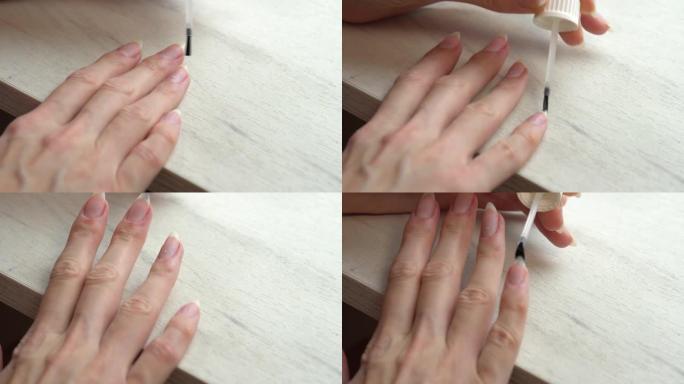 在用指甲油涂指甲之前先涂底涂层，在家进行自我修指甲