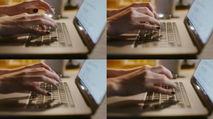 在笔记本电脑上打字整齐的女性双手特写