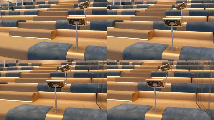 现代室内空会议厅蓝色座位整齐排椅空位观众礼堂听众商务公共活动正式会议无人教育讲座研讨会房间出租
