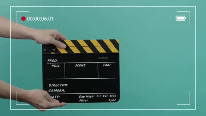 电影拍板。好莱坞导演电影《石板》。摄制组在录像中握住并拍拍胶片。用于剪切动作或视觉效果和场景道具。电