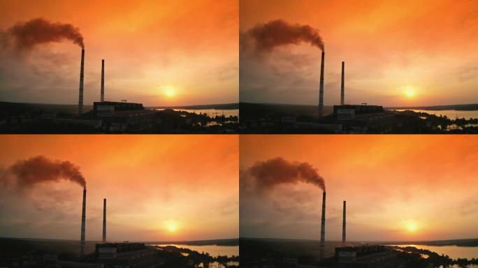 化学工业造成的环境中毒。工厂的烟囱正在向空中吹起巨大的烟雾。夜色背景下，高高的烟斗冒出黑烟。